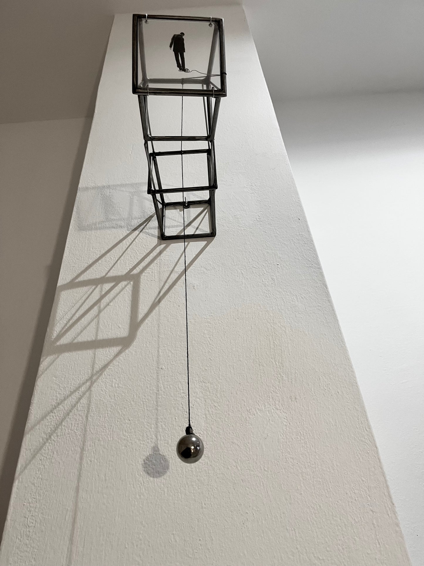 Hanging by a Thread, light and shadow sculpture