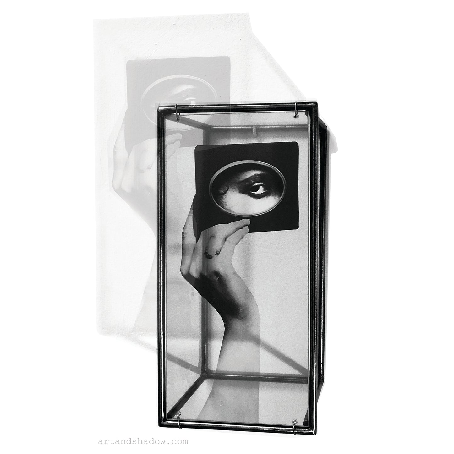 interior wall art, 3d metal art object handmade by art and shadow with an image of surrealist collage. eye and hand