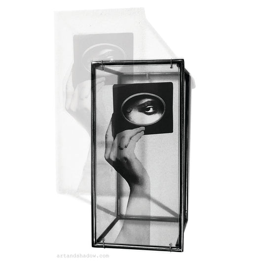 interior wall art, 3d metal art object handmade by art and shadow with an image of surrealist collage. eye and hand