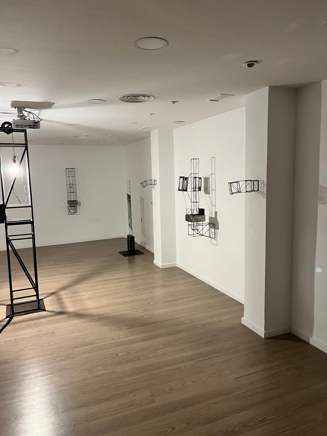 latest exhibition by Sergei Furst and Francesca Ori in Granada, spain experimenting with a kinetic light source in a steel sculpture