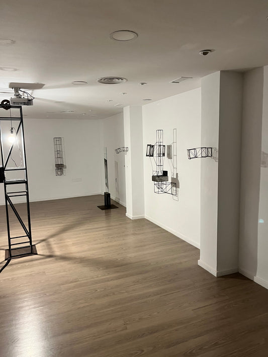 latest exhibition by Sergei Furst and Francesca Ori in Granada, spain experimenting with a kinetic light source in a steel sculpture