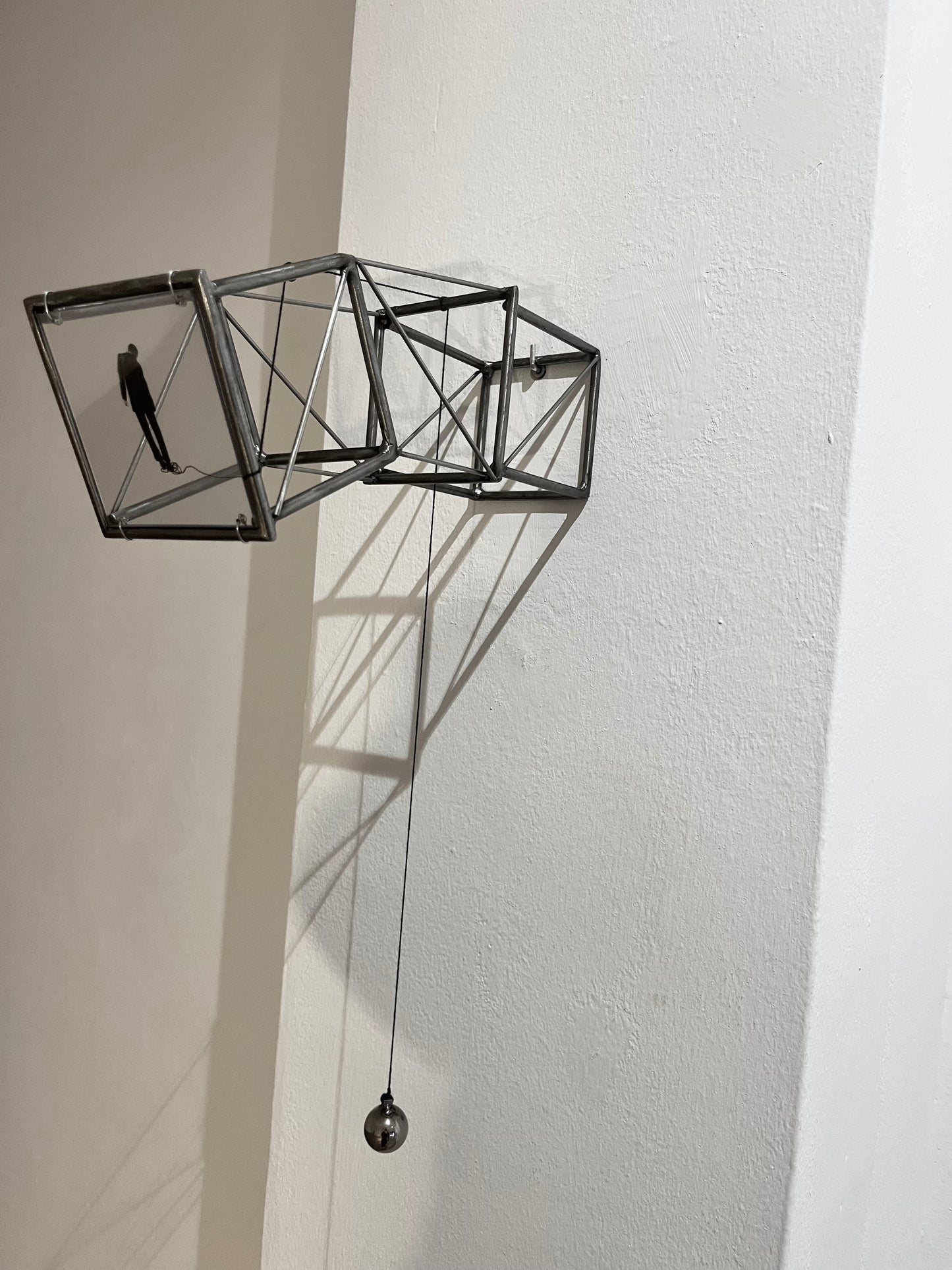 Hanging by a Thread, light and shadow sculpture