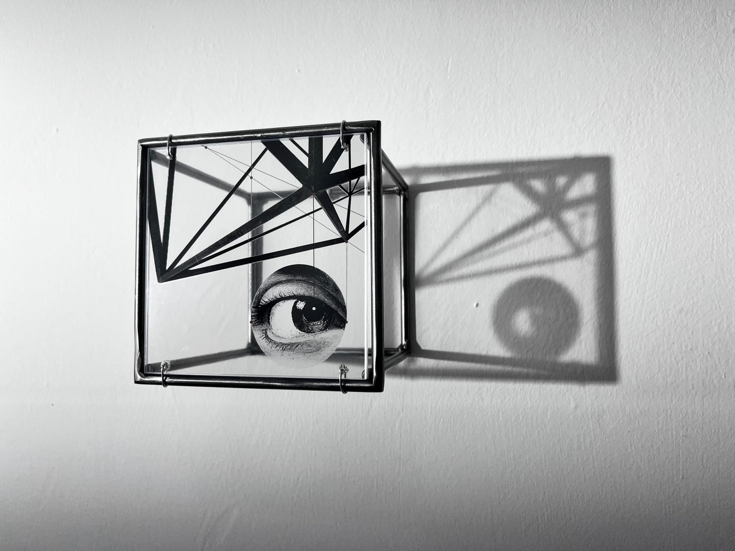 # side lighting of surrealist eye sculpture and shadow. Modern Interior Metal Wall Art Sculpture Knowing Glance – Original Shadow Sculpture by Furst_Ori | ArtandShadow Artandshadow