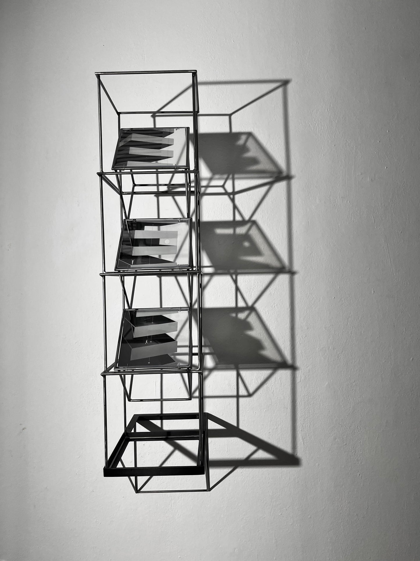 # Full frontal view of steel shadow sculpture projecting from wall with shadow effect. White bakground. Numbered Limited Edition Wall Sculpture Brutalist Tower – Limited Edition Shadow Sculpture by Furst_Ori Artandshadow