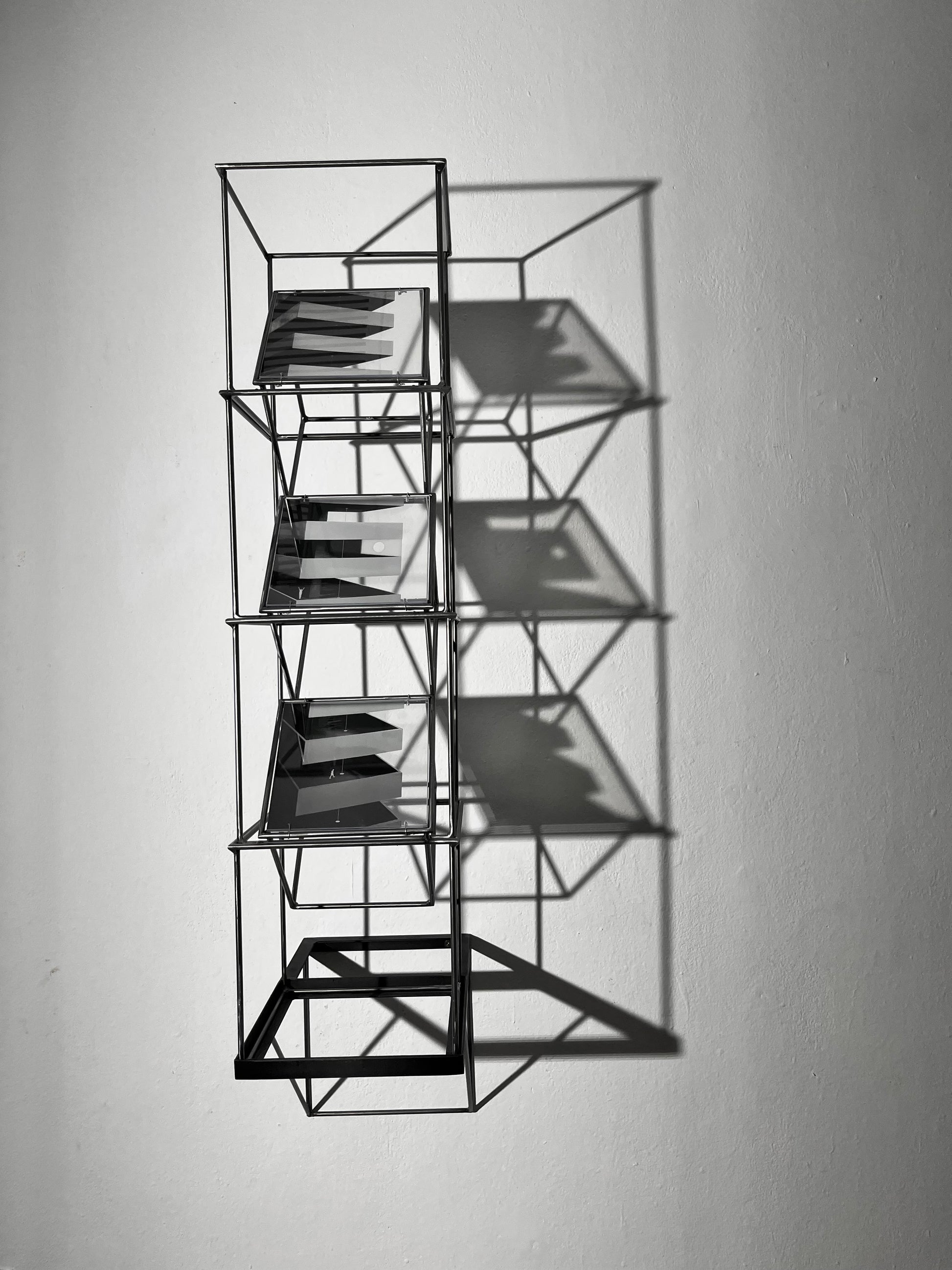 # Full frontal view of steel shadow sculpture projecting from wall with shadow effect. White bakground. Numbered Limited Edition Wall Sculpture Brutalist Tower – Limited Edition Shadow Sculpture by Furst_Ori Artandshadow