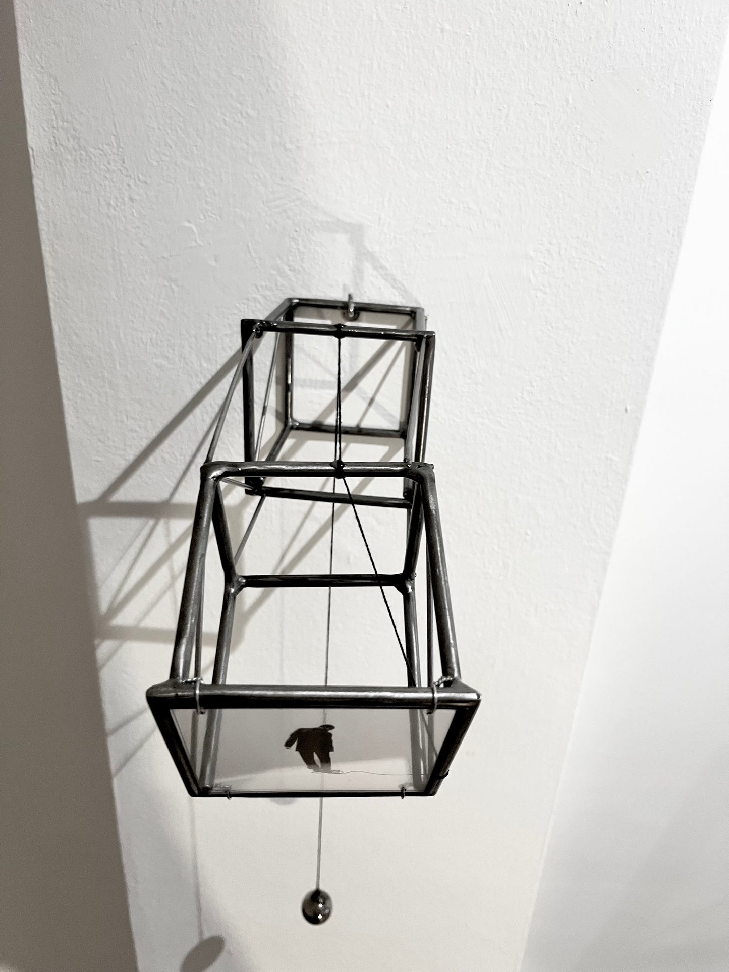 Hanging by a Thread, light and shadow sculpture