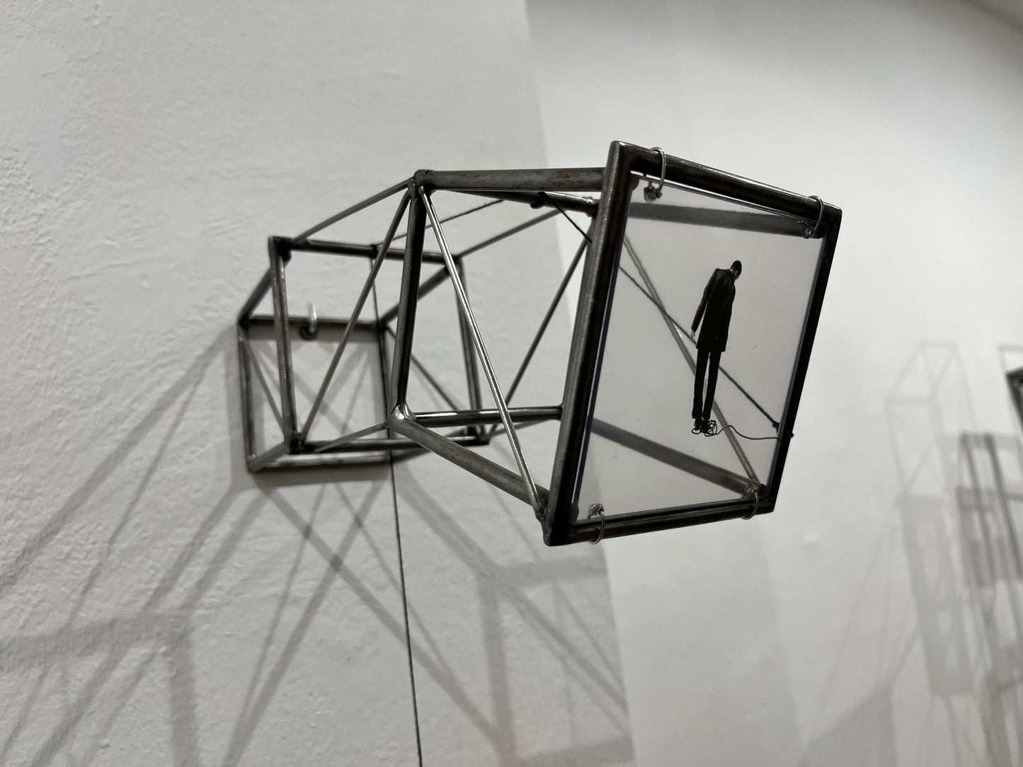 Hanging by a Thread, light and shadow sculpture