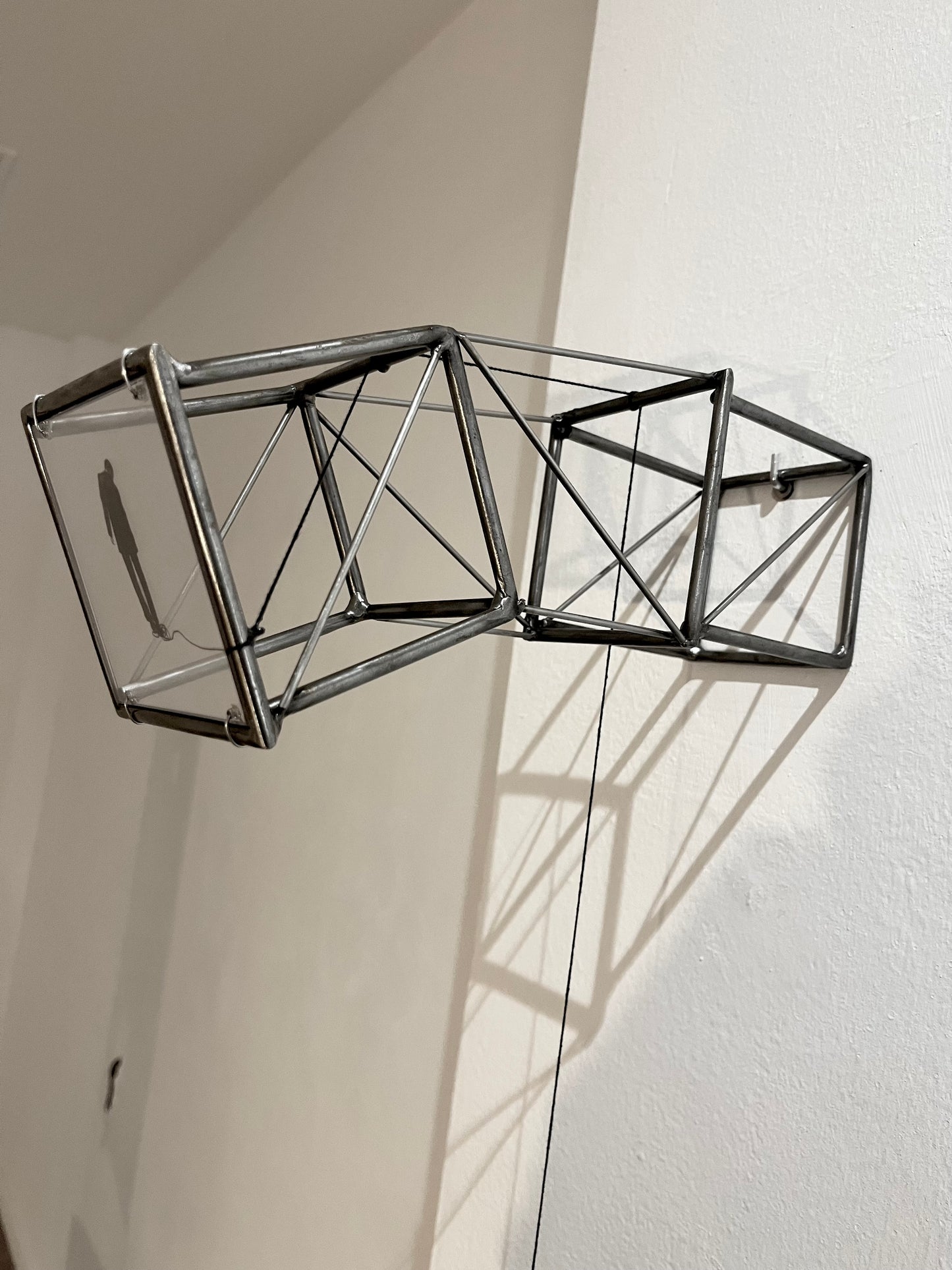 Hanging by a Thread, light and shadow sculpture