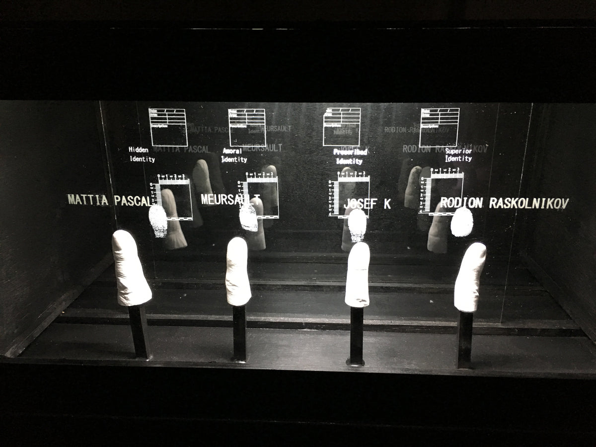 # rows of plaster cast fingers of fictional characters with their finger prints in mulpiple glass panel free standing artwork. Original Fine Art Sculpture Constructed Identity: Large Format Narrative Sculpture FURST_ORI