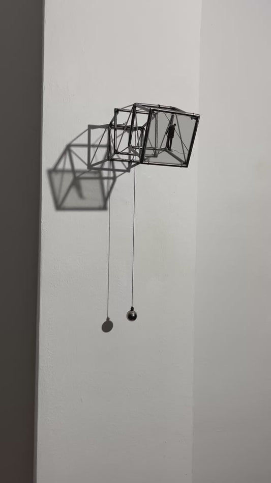Hanging by a Thread, light and shadow sculpture