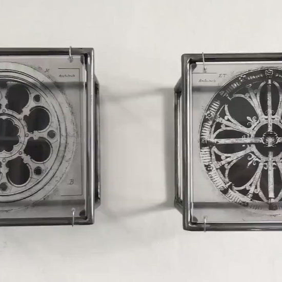 vintage architectural drawings of two French rose windows —  Château de Chantilly and Église Saint-Léonard de Croissy-sur-Seine, printed on transparent acetate housed in steel frame.