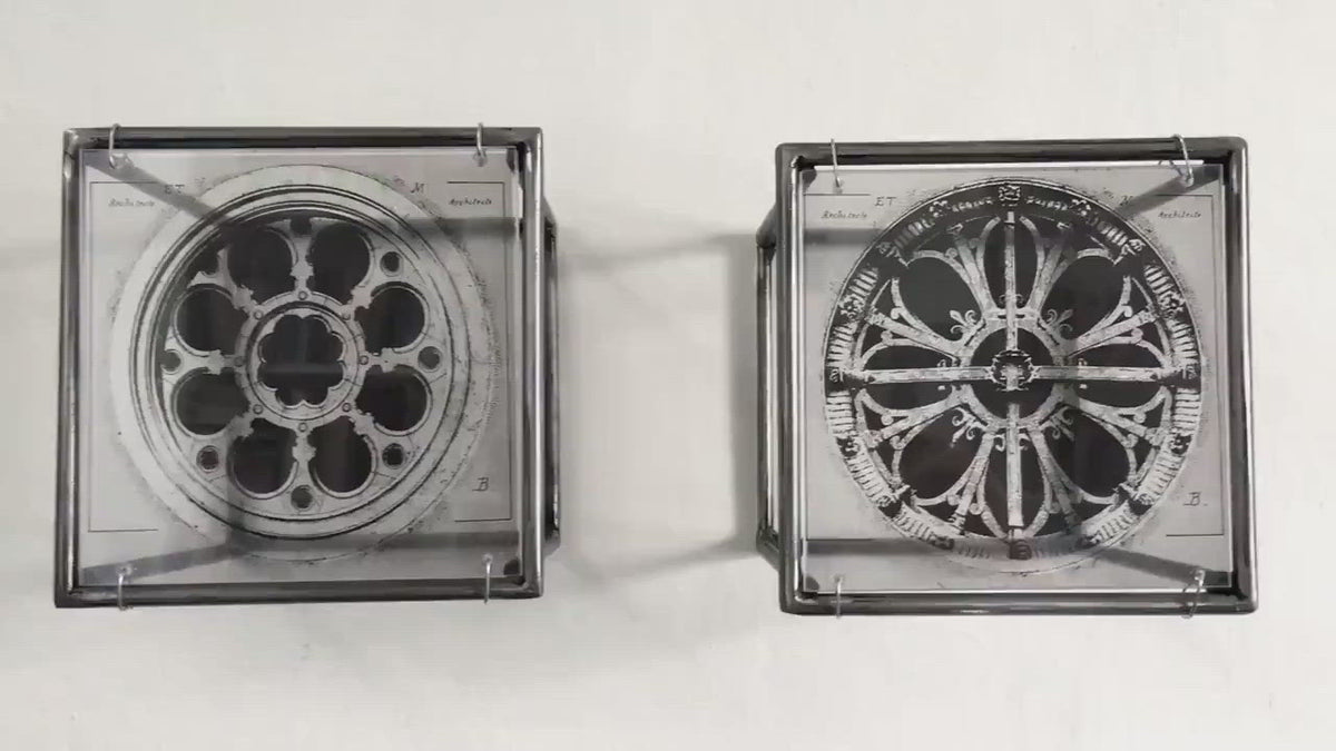 vintage architectural drawings of two French rose windows —  Château de Chantilly and Église Saint-Léonard de Croissy-sur-Seine, printed on transparent acetate housed in steel frame.