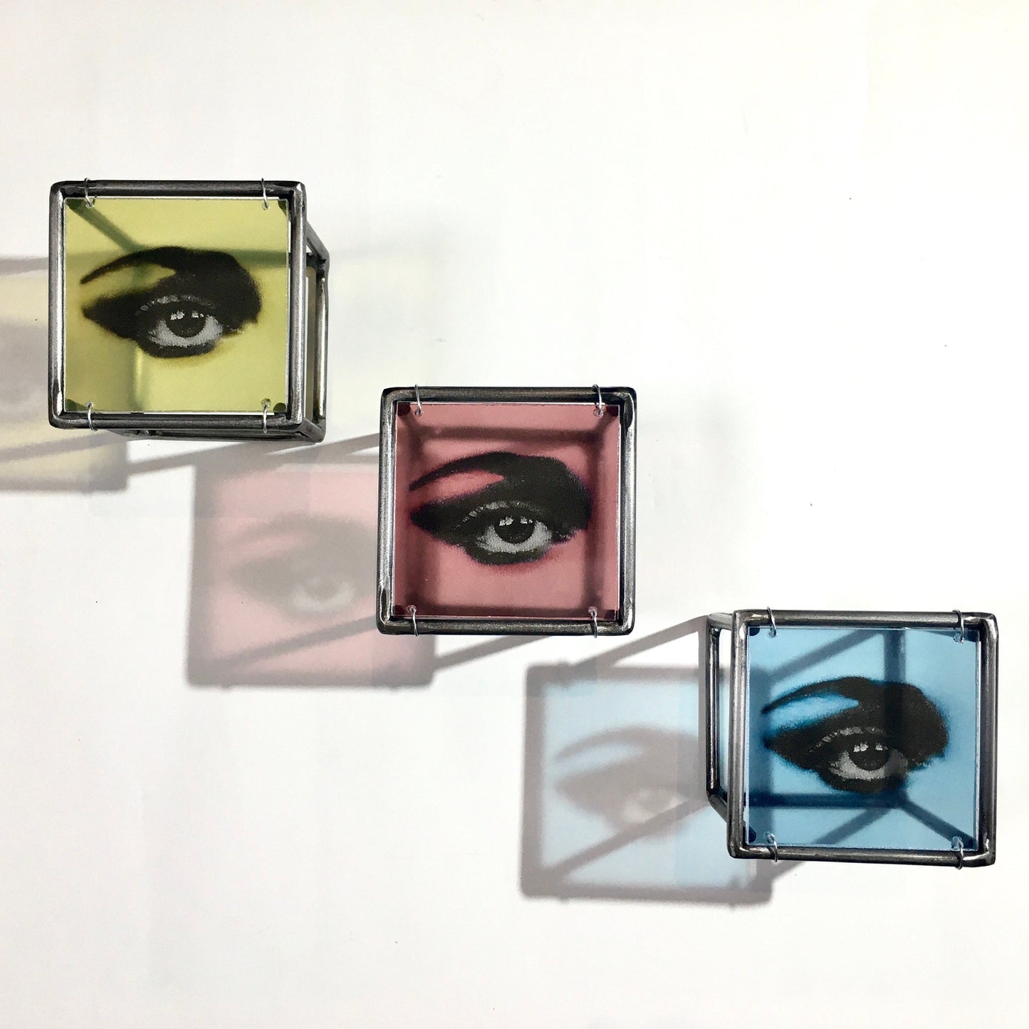 Pop art style, red, blue and yellow eyes. Cubic, metal wall sculpture. Art and shadow, home decor gift. - artandshadow