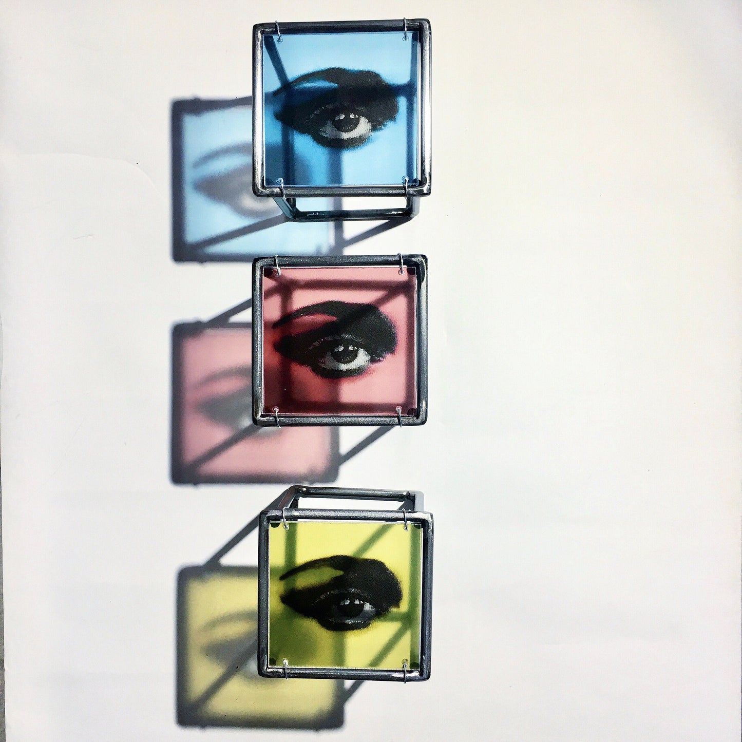 Pop art style, red, blue and yellow eyes. Cubic, metal wall sculpture. Art and shadow, home decor gift. - artandshadow