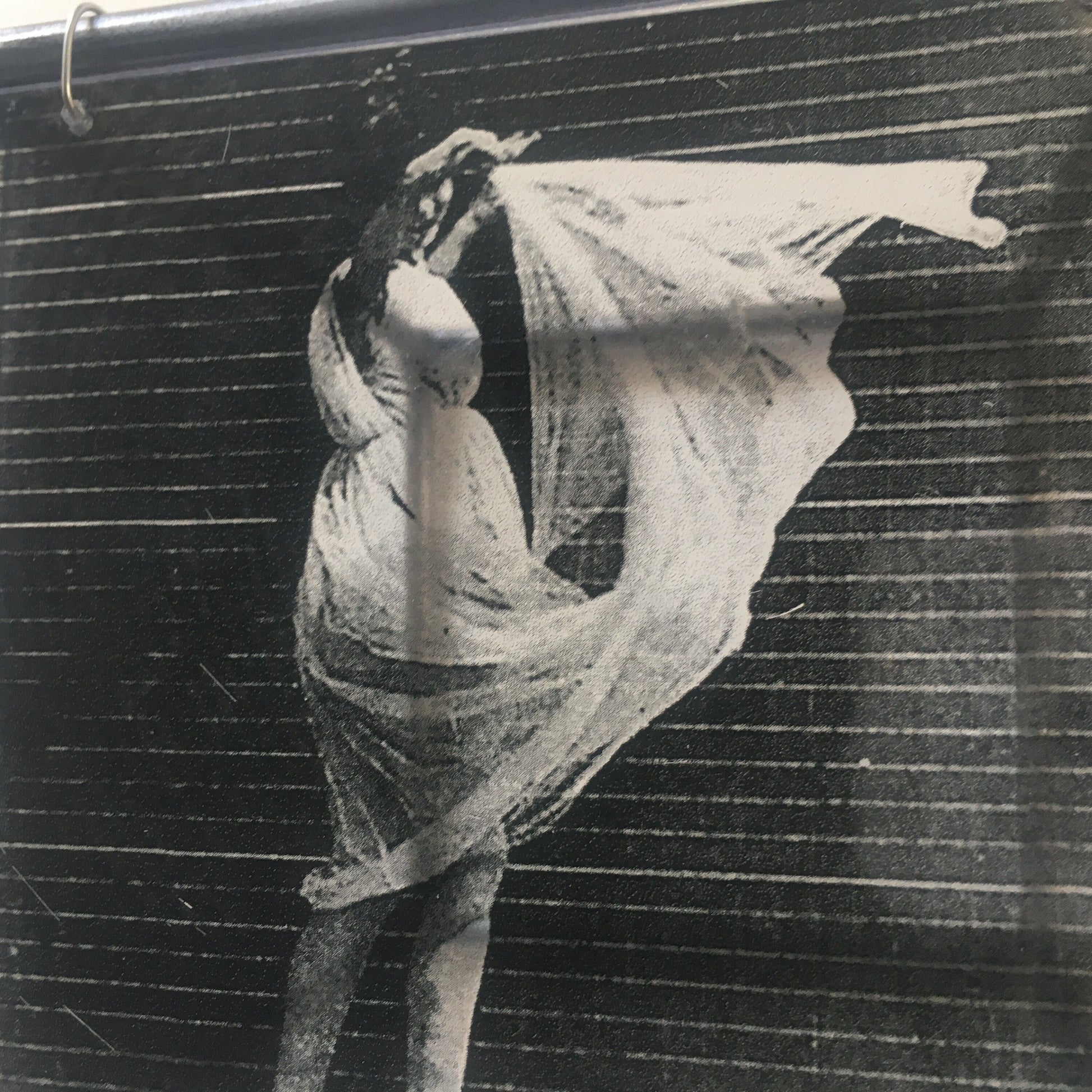 Eadweard J. Muybridge print of black and white photo “Women Dancing”.